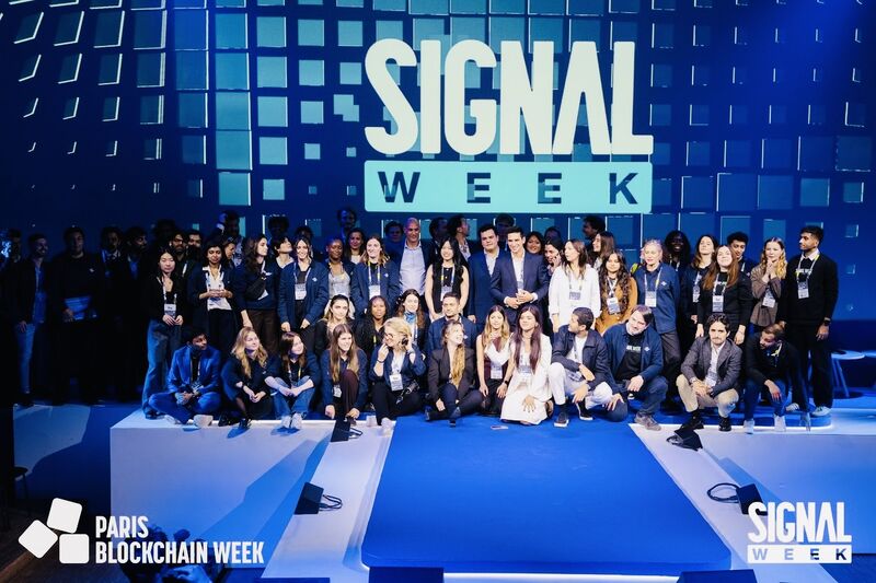 The Signal Week team on stage, the backdrop reading Signal Week with the Paris Blockchain Week logo alongside it